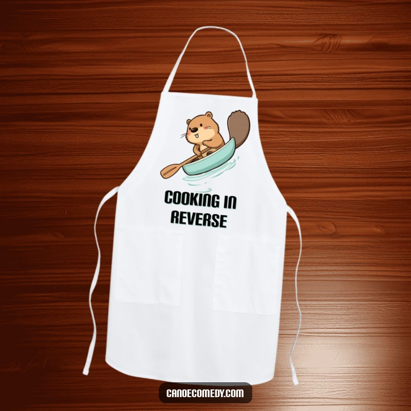 Funny beaver apron, comically paddling a canoe backward, a humorous kitchen accessory for cooking and BBQs.