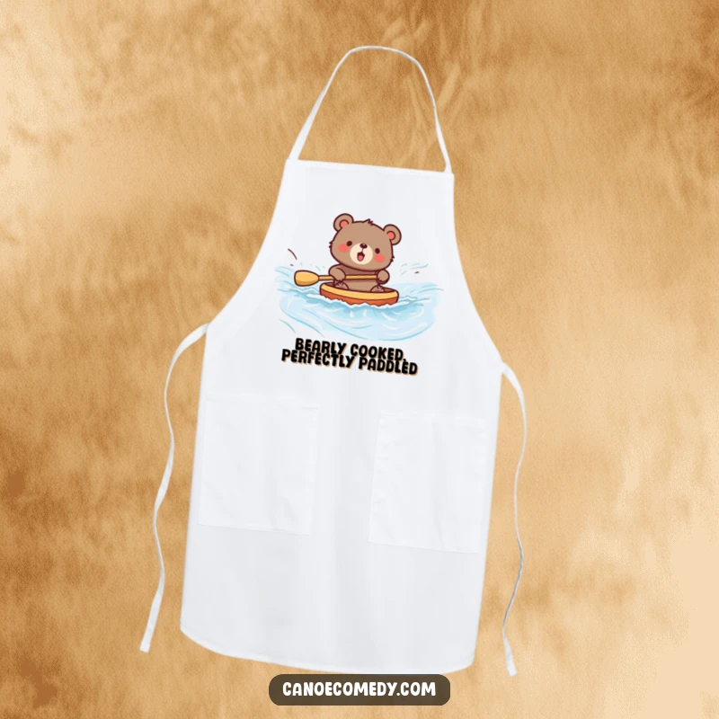 Funny bear apron showing a bear paddling a canoe with enthusiasm, bringing playful energy to the kitchen for cooking fun.