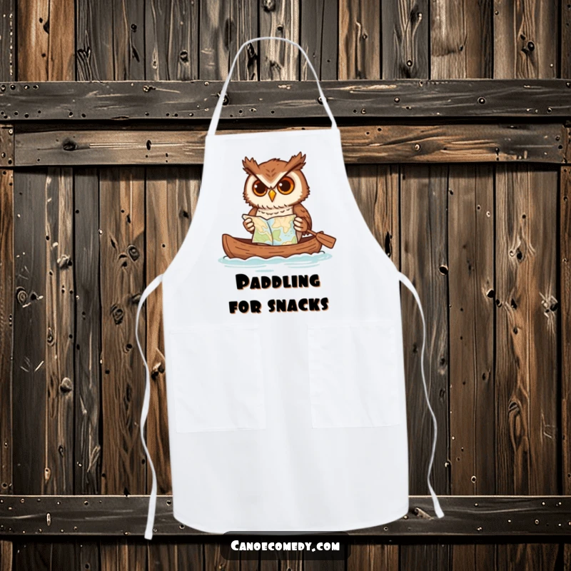 Funny owl apron, depicted paddling a canoe while consulting a map, a humorous kitchen accessory for culinary adventurers.