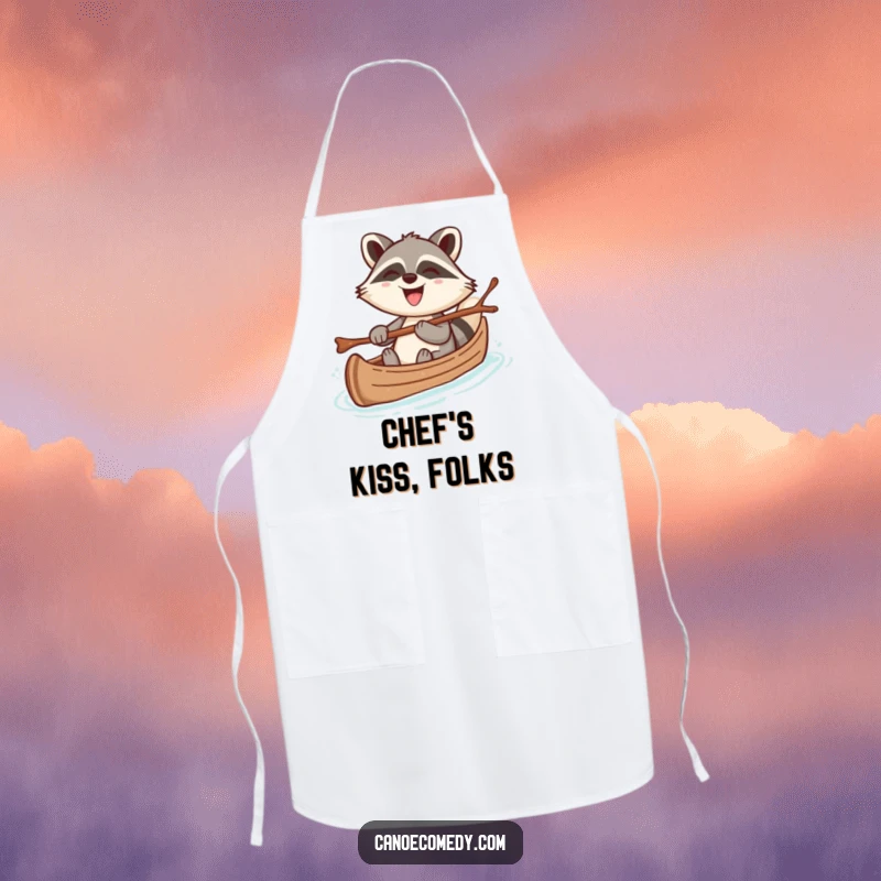 Funny apron with a cheerful kawaii raccoon steering a canoe with a twig, grinning broadly, perfect for humorous kitchen protection.