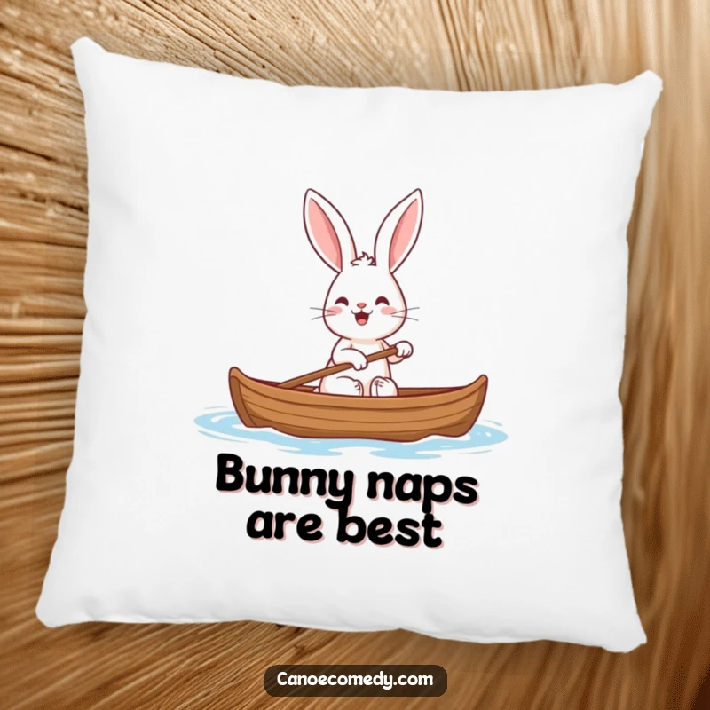 Funny decorative pillow featuring a cheerful rabbit with big ears paddling a canoe, adding comfort and humor to any setting.
