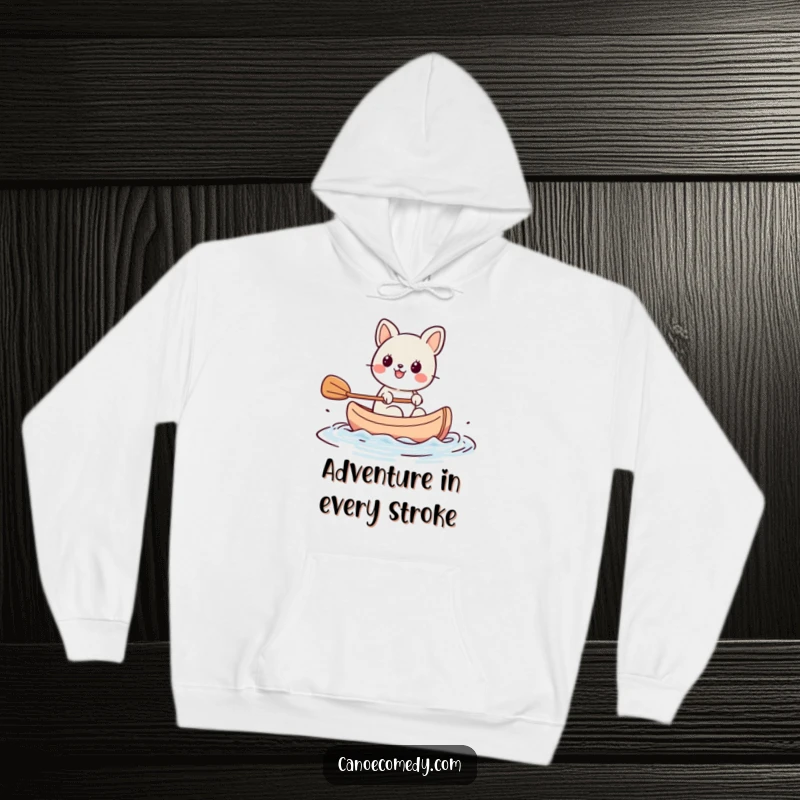 Funny Kawaii animal character paddling a tiny canoe with great enthusiasm, depicted on a soft hoodie, bringing warmth and humor.