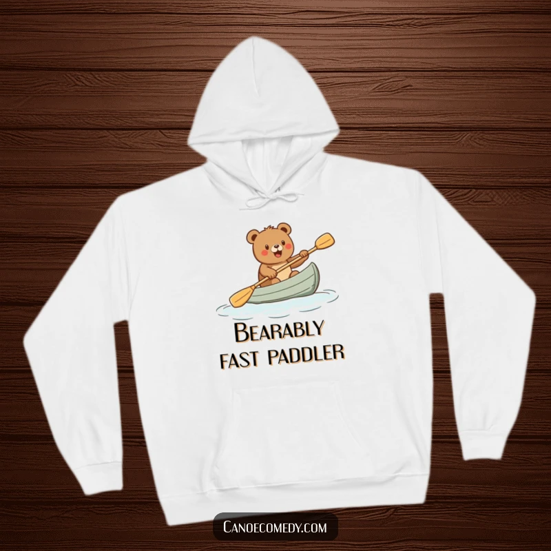 Funny hoodie with a cartoon bear paddling a canoe energetically, radiating fun and a love for the outdoors, a great funny gift idea.
