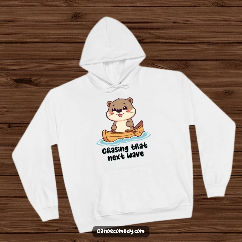 Funny Hoodie showcasing a kawaii otter character expertly steering a canoe with a gleeful, focused look. Ideal for comfort and smiles.