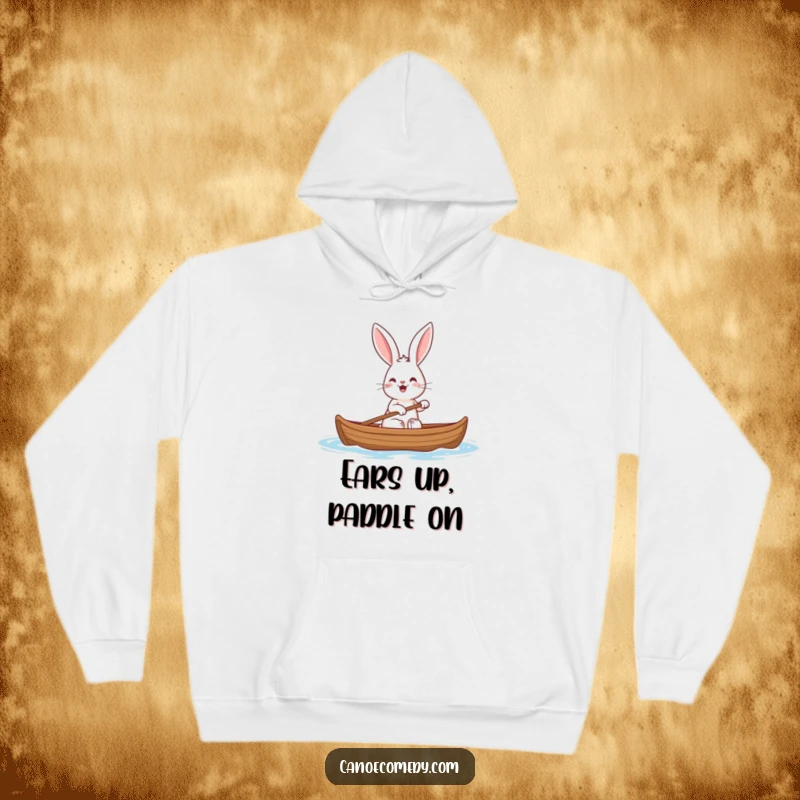 Funny rabbit hoodie depicting a cheerful rabbit with large ears paddling a canoe, bringing warmth and humor.
