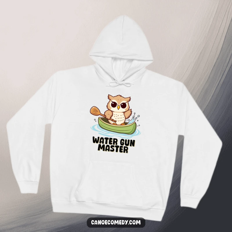 Funny owl hoodie, captured mid-splash, playfully sending water from a canoe, a cozy and humorous apparel piece.