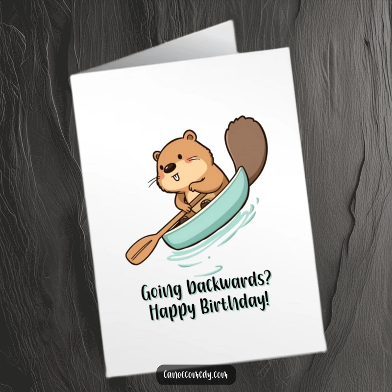 Funny Free Printable Birthday Card featuring a beaver comically paddling a canoe backward, causing chaos and laughter.