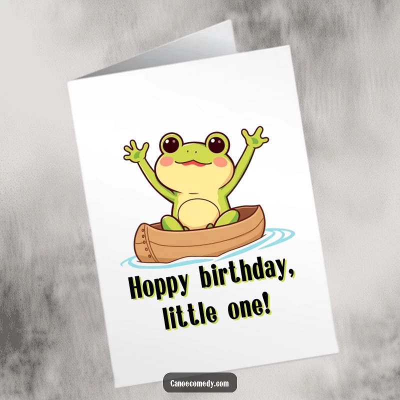Funny Free Printable Kawaii frog excitedly waving arms in a canoe on a birthday card.