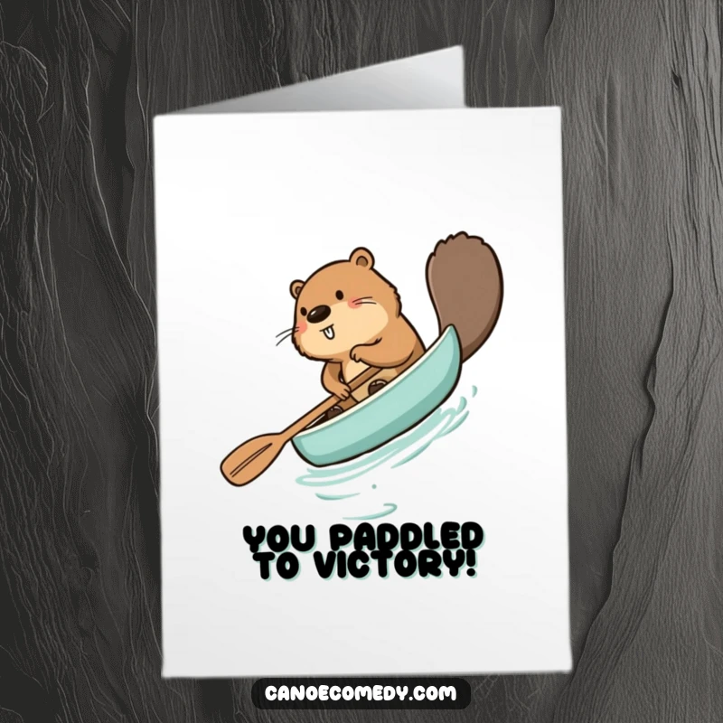 Funny Free Printable Congratulations Card with a beaver comically paddling a canoe backward, symbolizing a humorous journey to success.