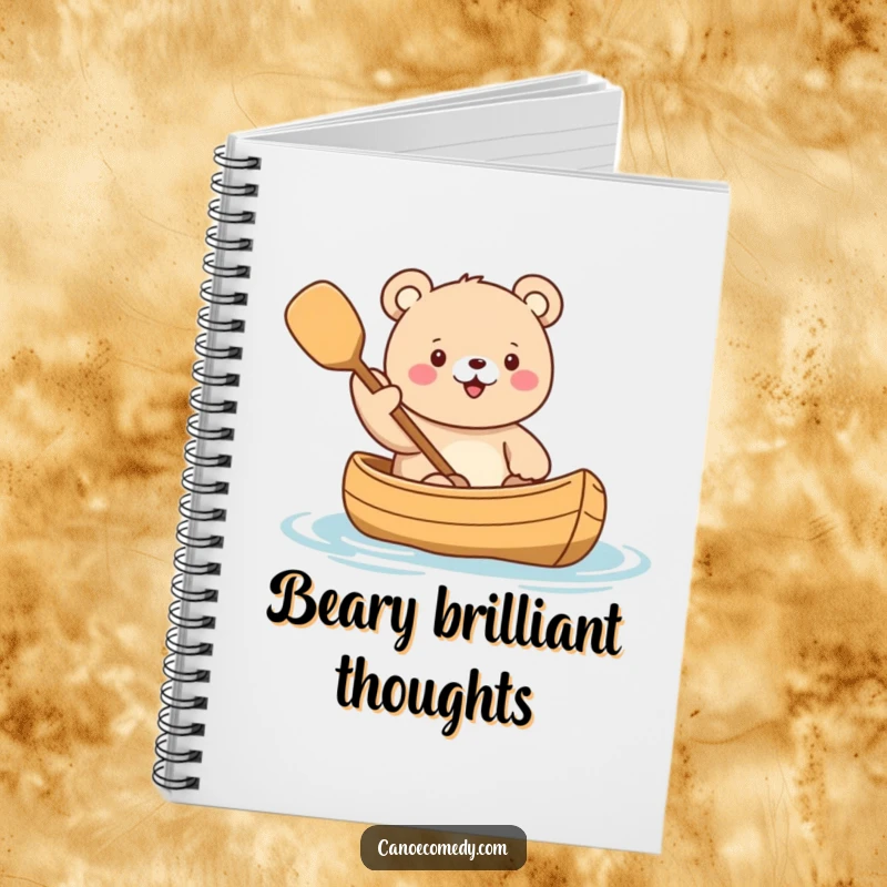 Funny Kawaii Bear Adventure Notebook featuring a cute bear character enthusiastically waving a paddle from a canoe, ready for inspired ideas.