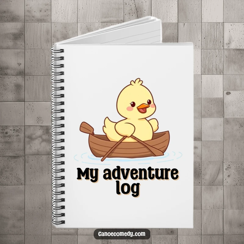 Kawaii duck smiling and paddling a tiny canoe, featured on a notebook for jotting down ideas.