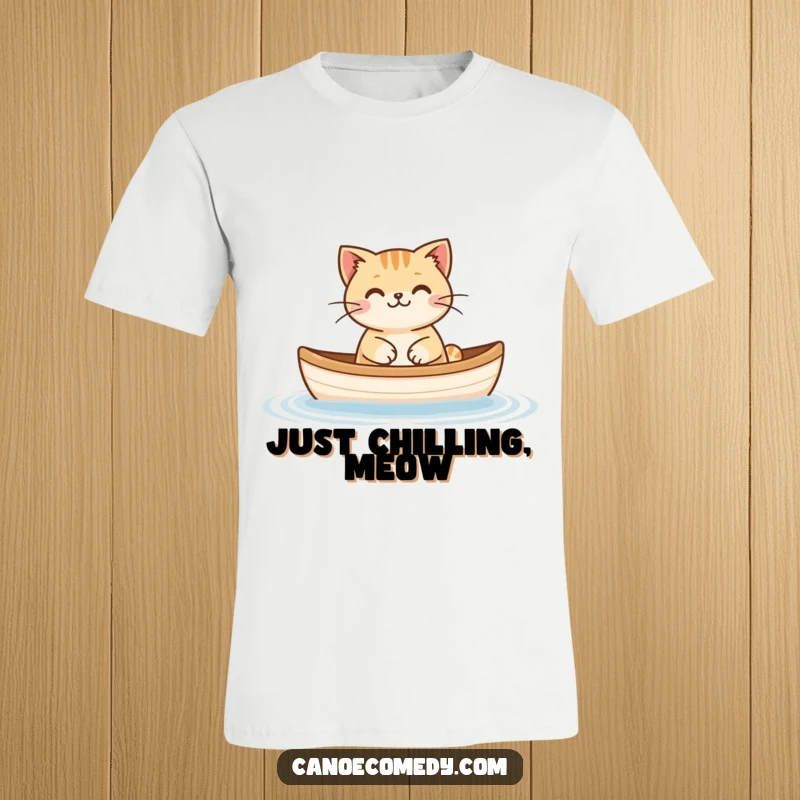 Funny Cat Floating Canoe T-Shirt, depicting a content cat peacefully adrift in a small canoe, radiating calm.