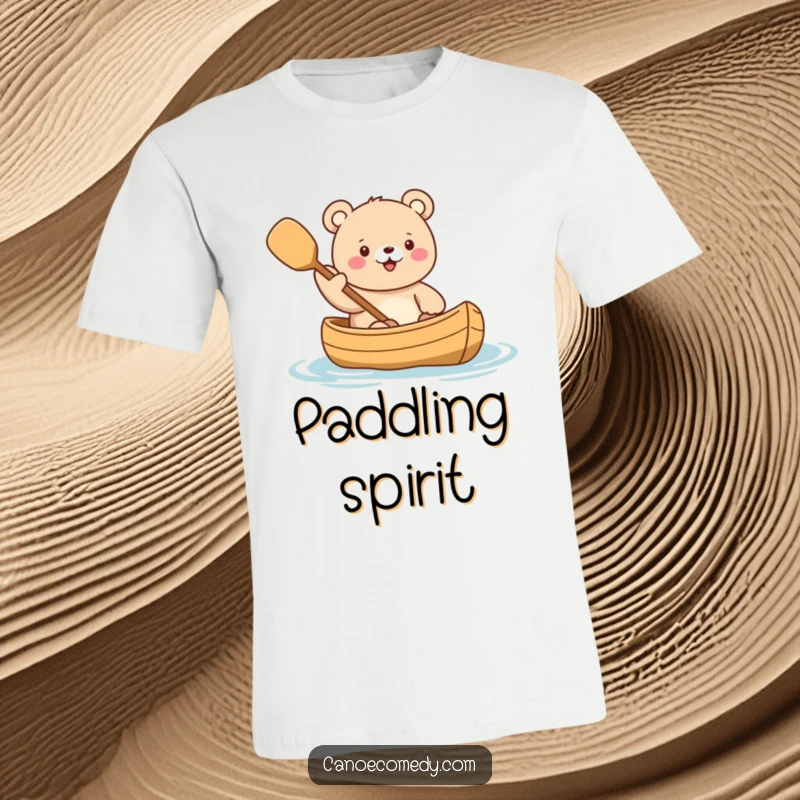Funny Kawaii Bear Canoe T-Shirt showing a cute bear character enthusiastically waving a paddle while seated in a canoe, ready for action.