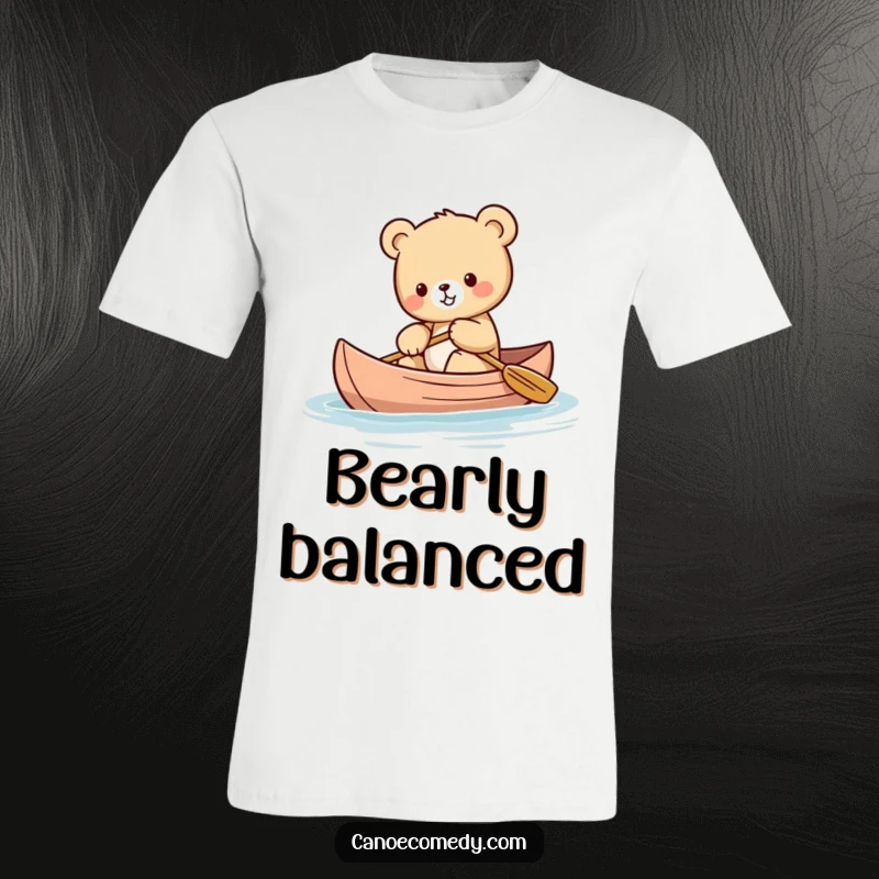 Funny Kawaii bear cub t-shirt featuring a sweet bear cub struggling to maintain balance while paddling a canoe.