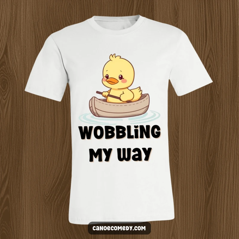 Funny t-shirt featuring a shy kawaii duckling in a tiny canoe, looking nervous, representing relatable and gentle humor.