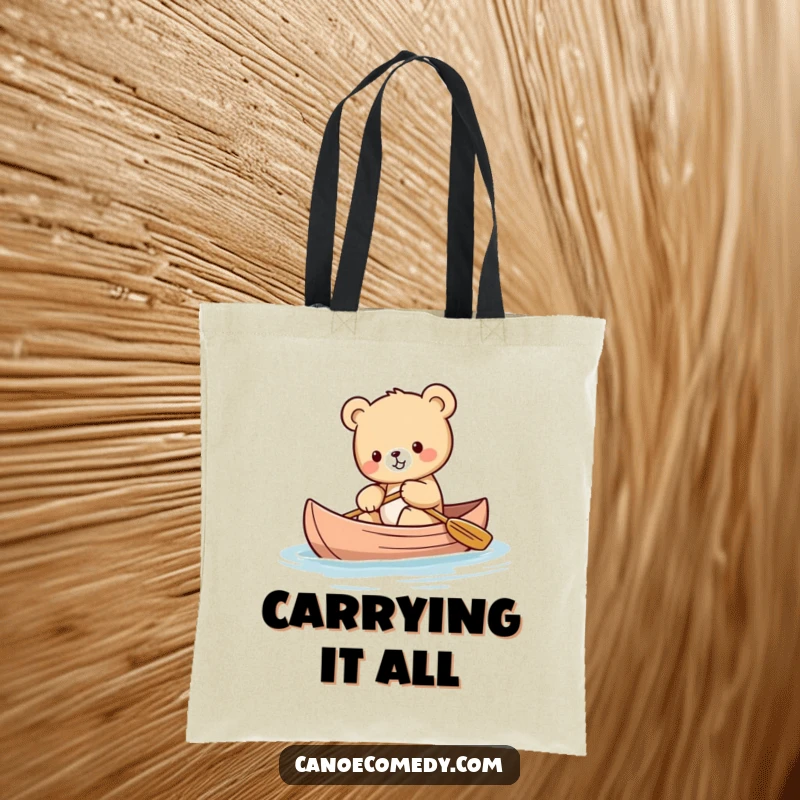 Funny Kawaii bear cub tote bag showing a small bear cub trying its best to balance in a canoe.