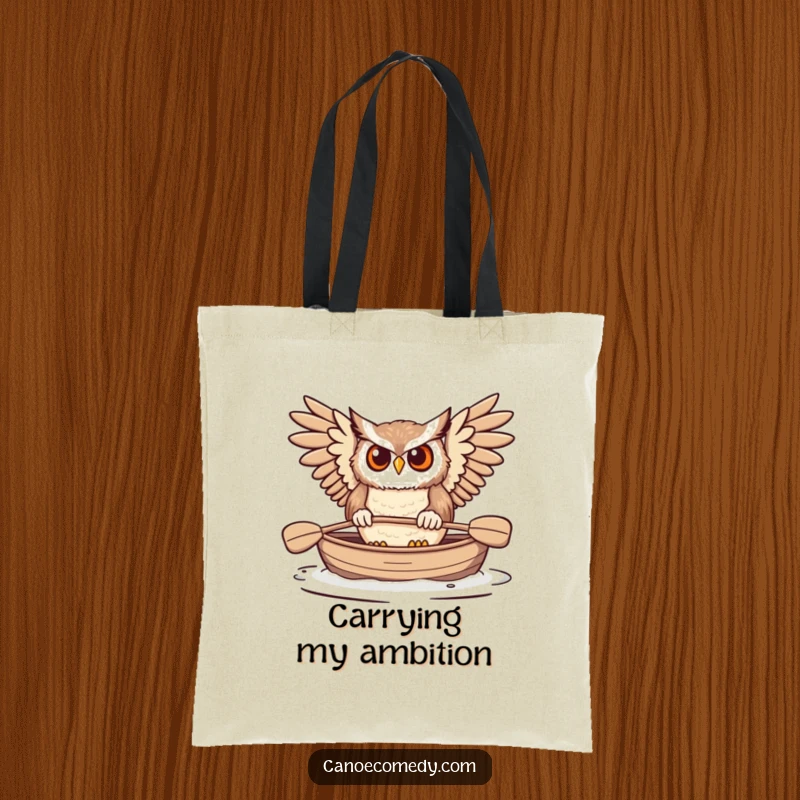 Funny Owl Paddling Canoe Tote Bag, showing a focused owl paddling its canoe, embodying determination and outdoor spirit.