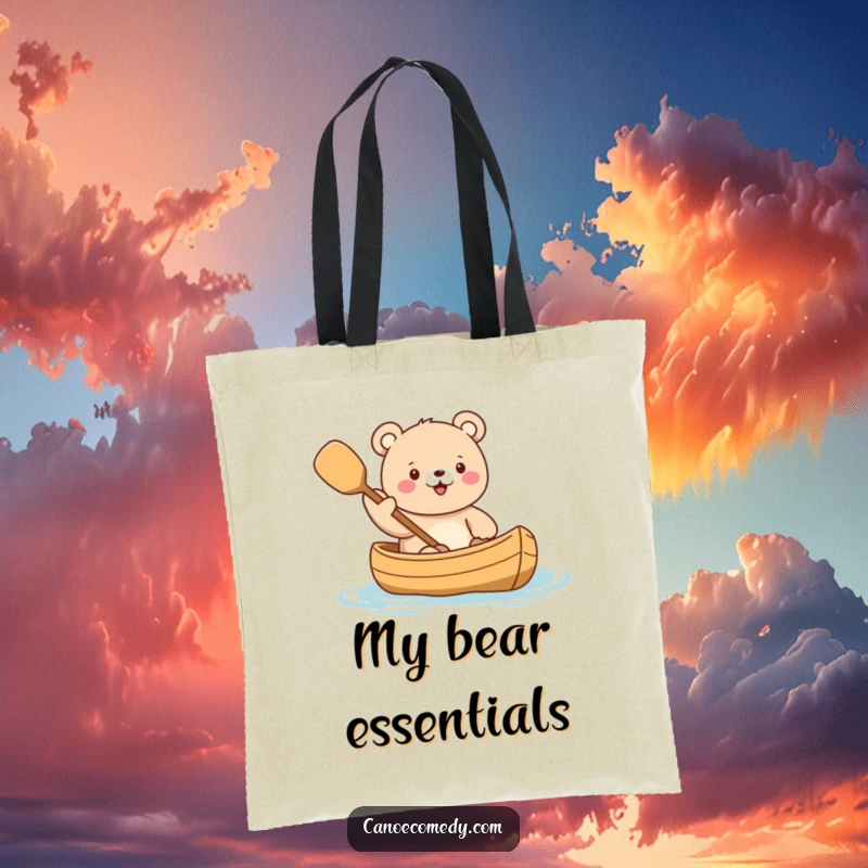 Funny Kawaii Bear Canoe Tote Bag showing a cute bear character enthusiastically waving a paddle from a canoe, perfect for carrying essentials.