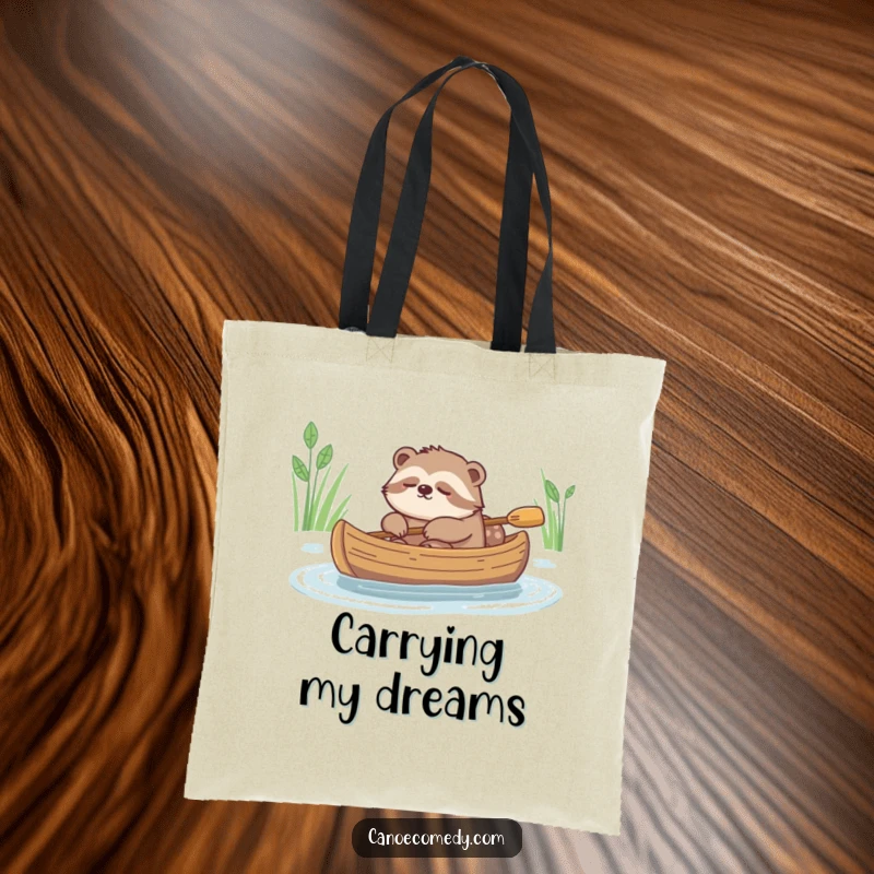Funny tote bag design with a sleepy sloth leisurely drifting in a canoe, embodying pure chill.